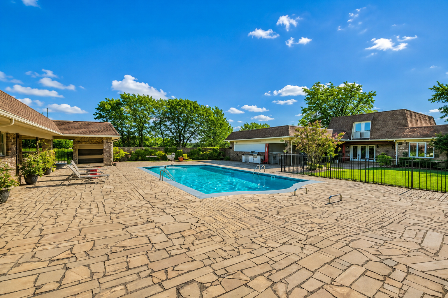 Pool and stone patio at the private retreat property